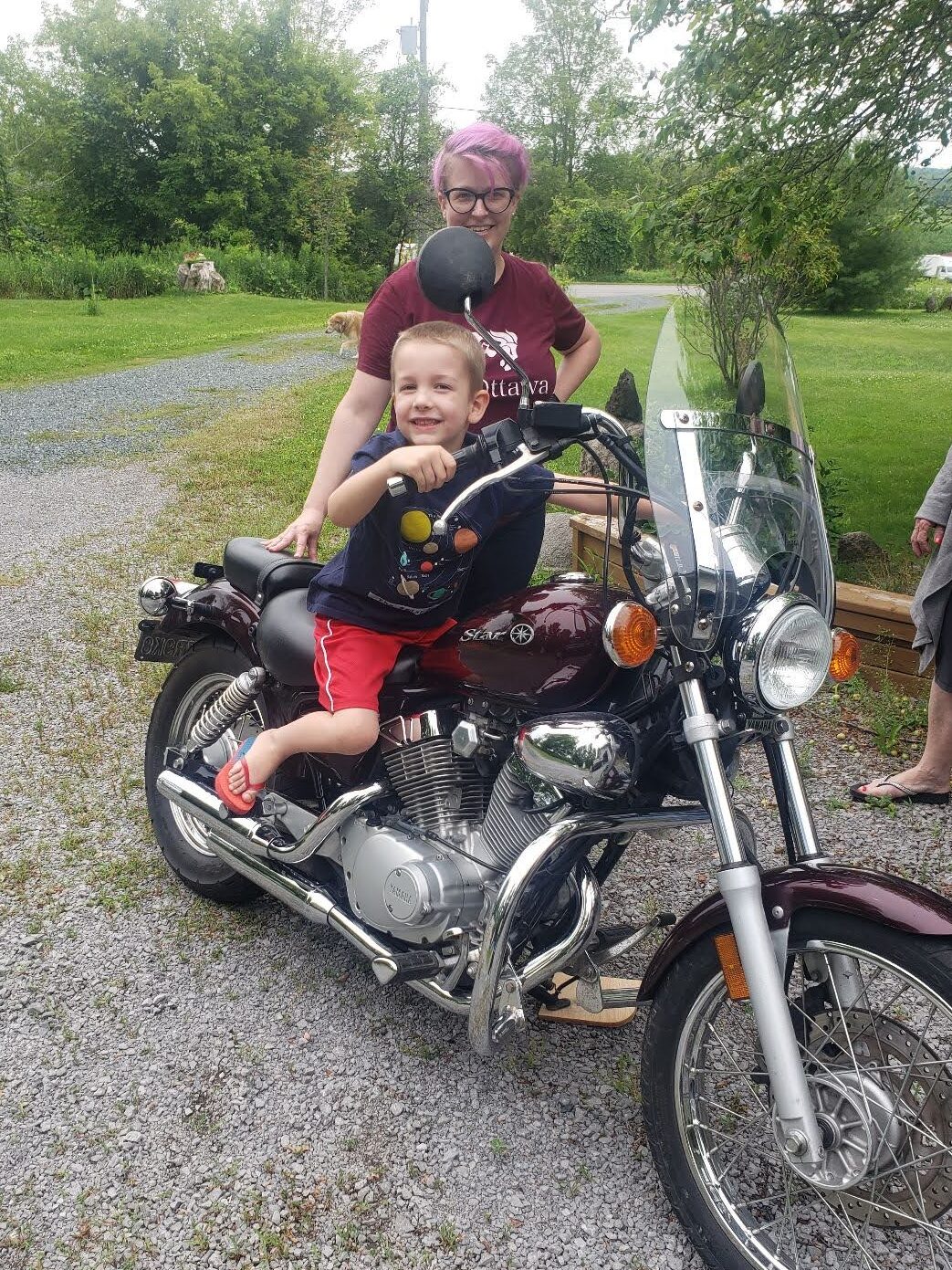Heather Woods teaching her nephew how to “ride” her bike