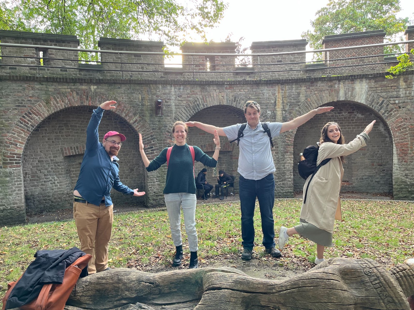 Four Scholarly Communications Lab members posing letters to spell "CWTS"